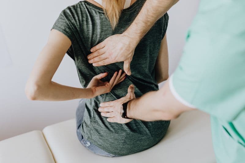 Senior practitioner training a new injector — onboarding aftercare standards