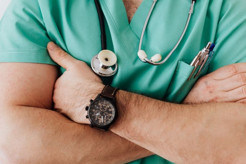 Patient signing a consent form at a clinic — informed consent versus aftercare documentation