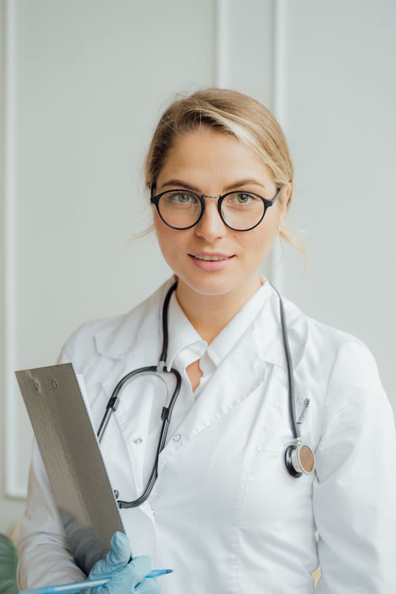 Patient reading instructions on a phone — digital aftercare versus paper handouts