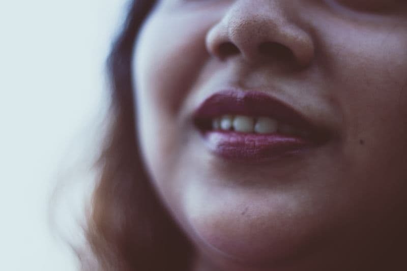 Woman with bright toothy smile — Botox for gummy smile treatment guide